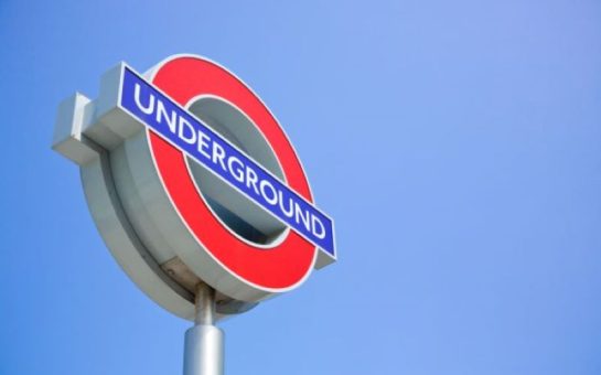 london underground sign on a post