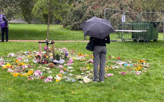 Mourners prepare for the arrival of the Queen's coffin