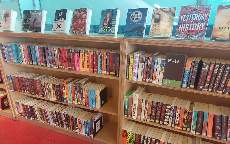 Shelves of children's books in a library