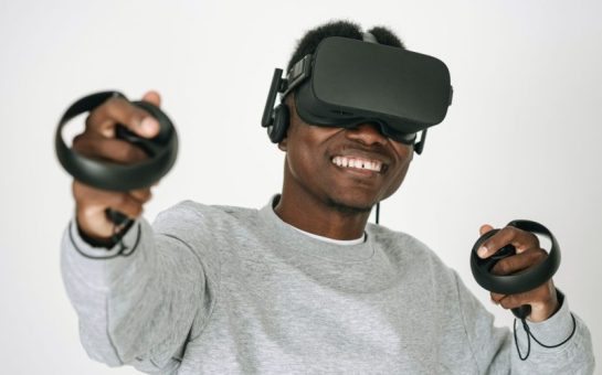 Person wearing a VR headset and gloves