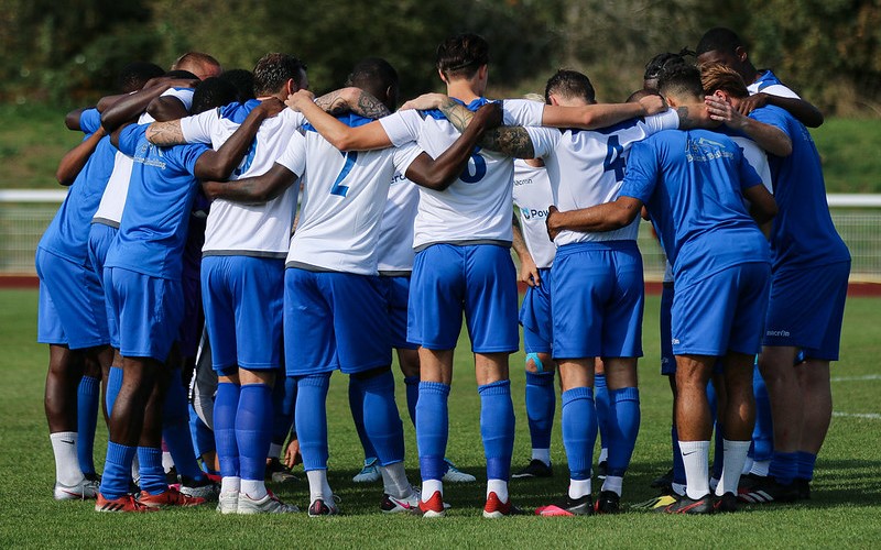 Enfield Town players in a huddle