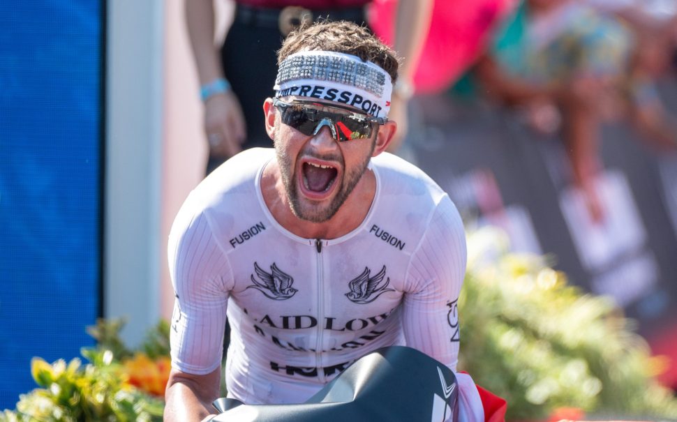 Sam Laidlow crossing the finish line on a bike