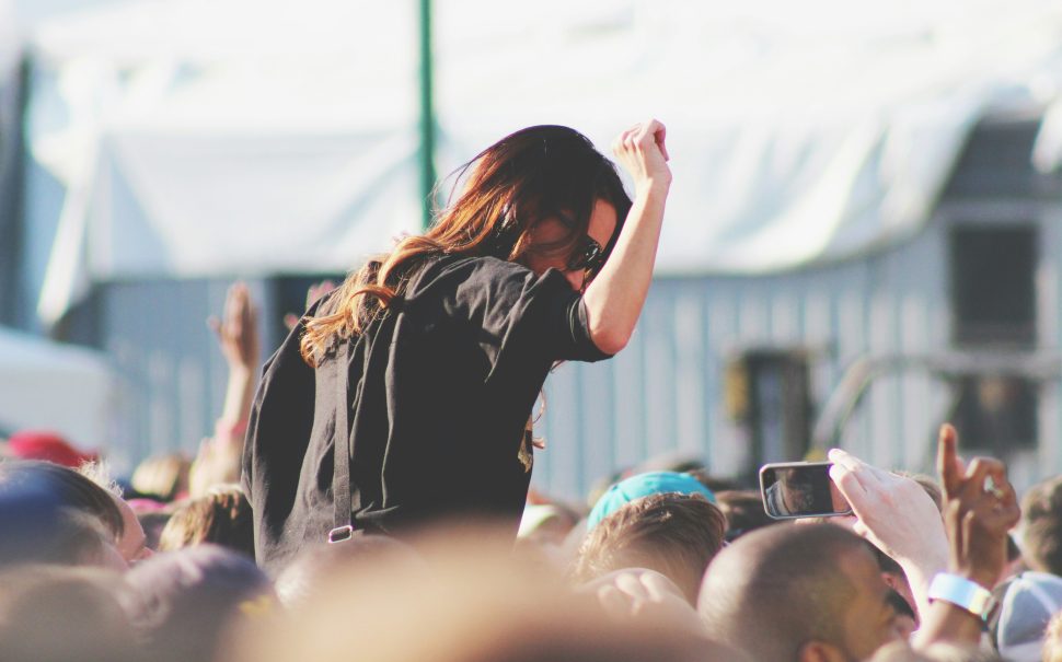 Woman held aloft in festival crowd