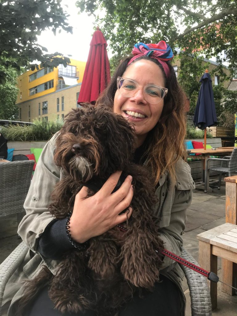 Empathy Animals UK founder Nadia holding a brown dog.