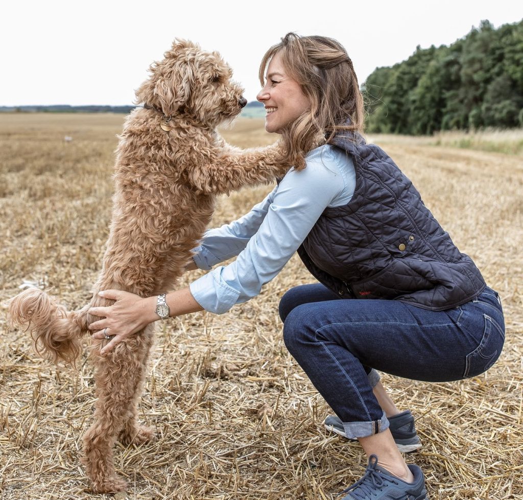 Miniature goldendoodle Nigel and his owner Melissa.