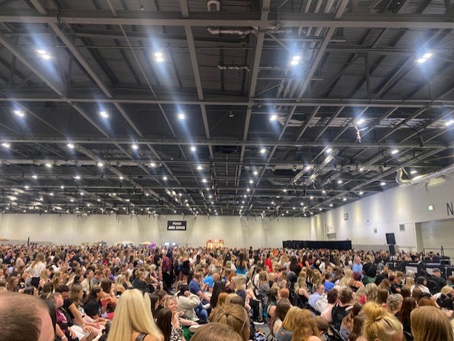 Crowds wait for talk from actors at London fantasy fan convention. 