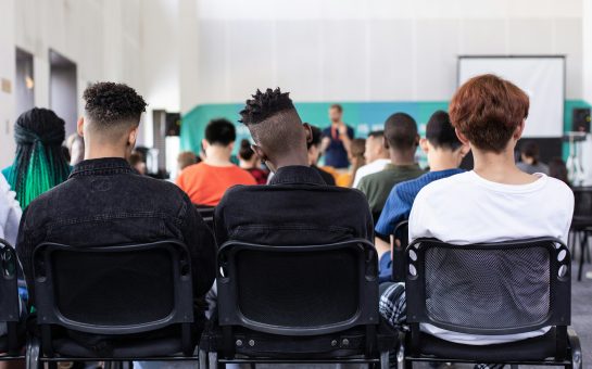 The backs of heads in a school classroom