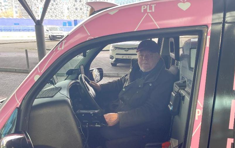 George Burbrick, a black cab driver, sitting behind the wheel of his taxi. Picture Credit: Photo taken by Christian Maddock