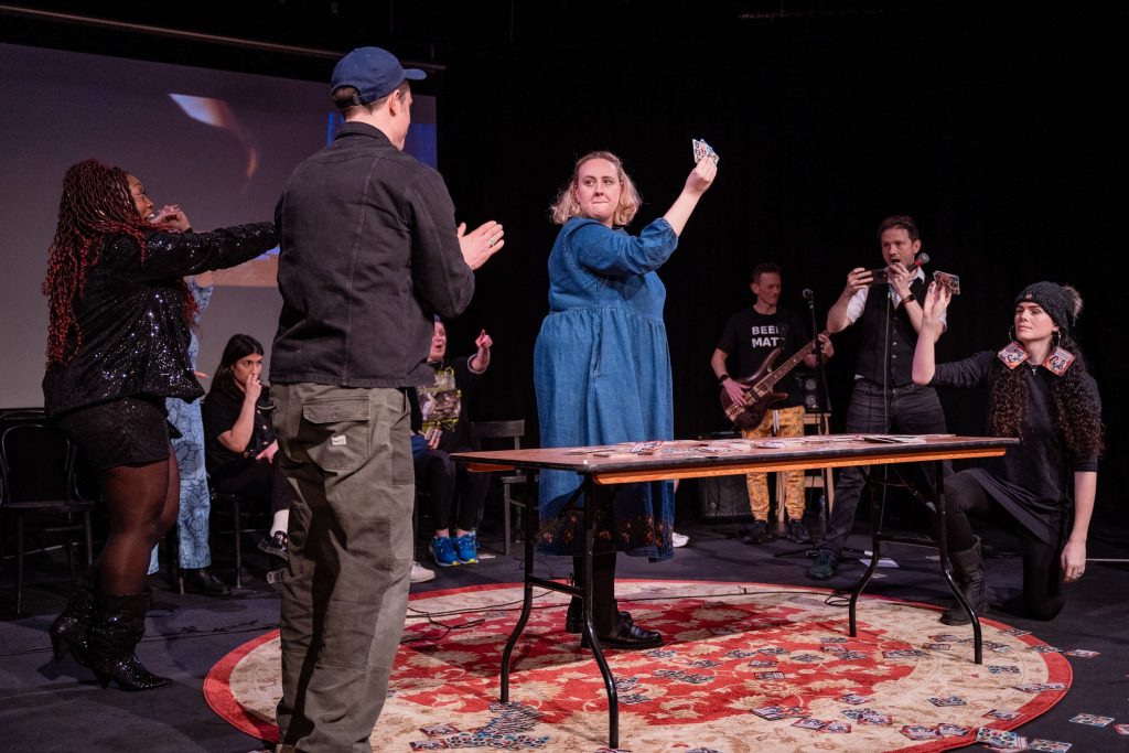 Comedian Helen Bauer competes in the Comedians Beer Mat Flipping Championship