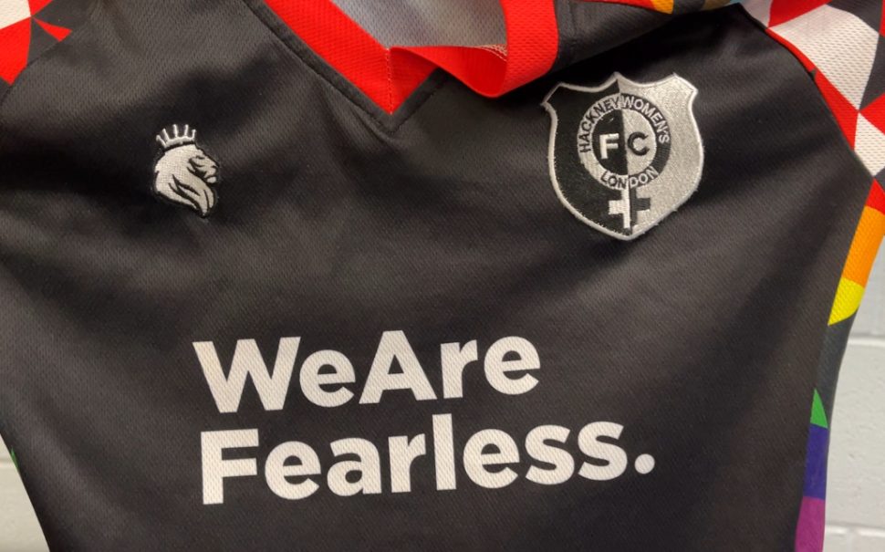 Hackney Women's black football kit with rainbow trim, which says 'We Are Fearless' written across the middle.