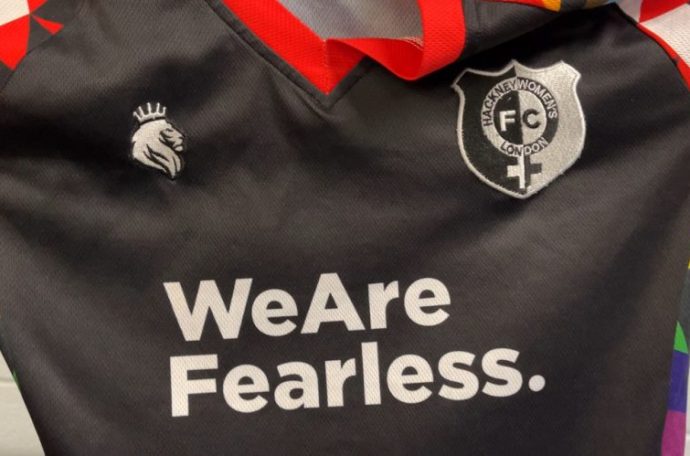 Hackney Women's black football kit with rainbow trim, which says 'We Are Fearless' written across the middle.